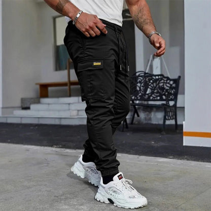 👖50% KORTING🏃 Werkkleding-joggingbroek | Trekkoord in de taille · Duurzaam polyester · Taps toelopende pijpen · Meerdere zakken