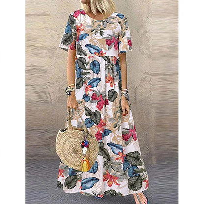 Retro maxi-jurk met bloemenprint 🌼 Ronde hals, korte mouwen, losvallend en zwierig, waardoor je eruitziet alsof je zo uit een tuin bent gestapt 🌿